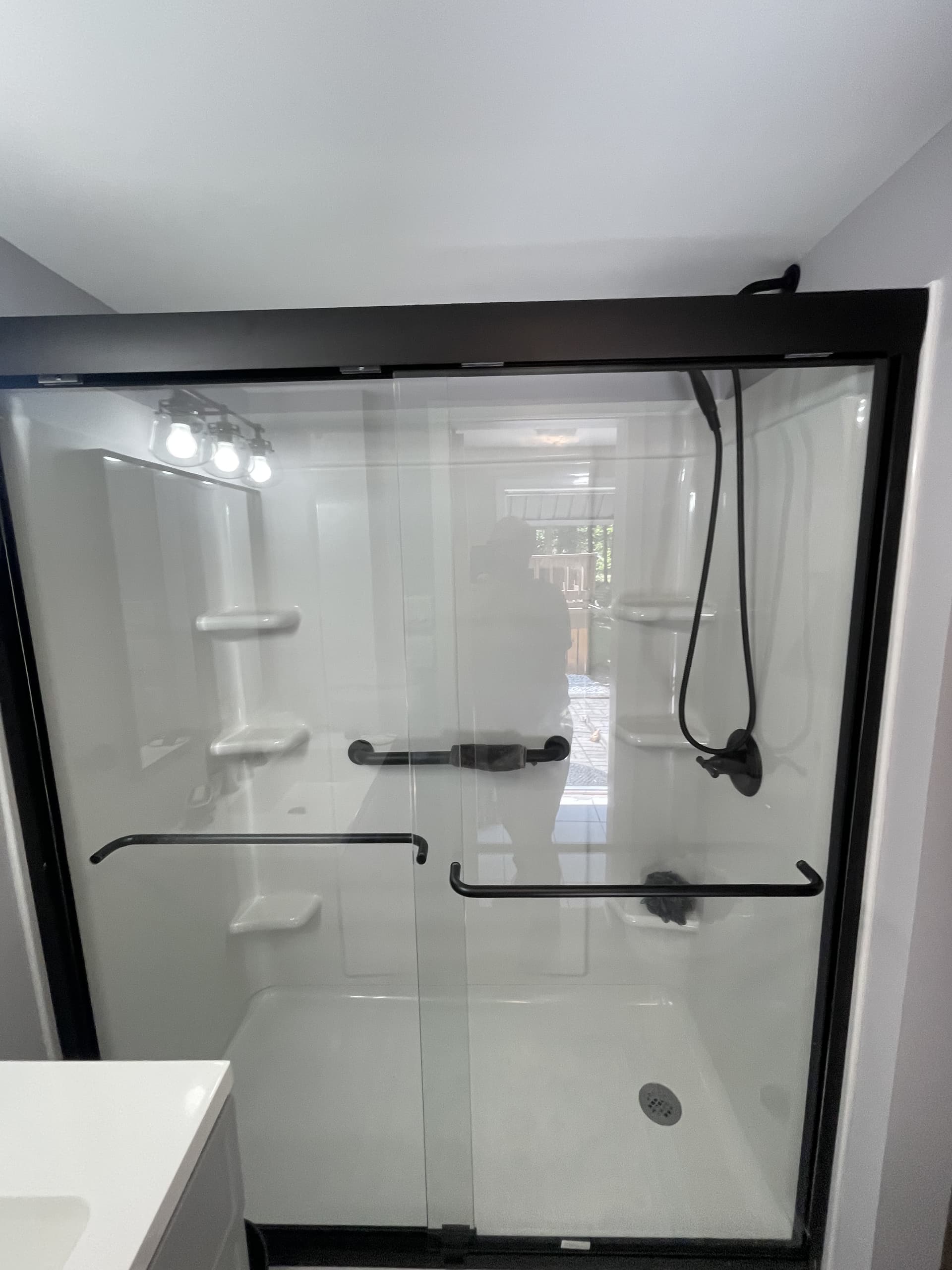 Finished shower detail with updated fixtures and trim.