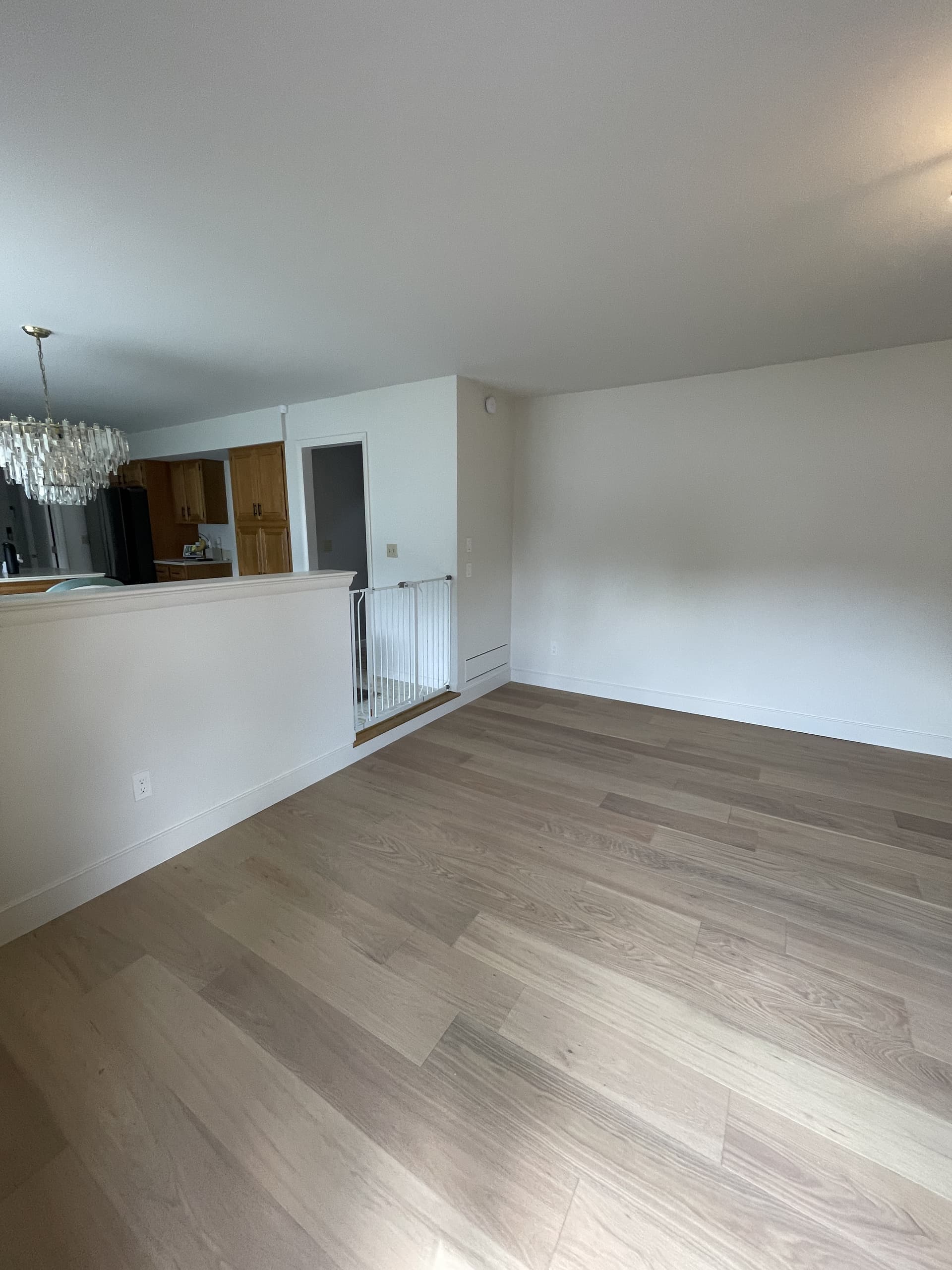 Finished living room with clean drywall and paint-ready surfaces.