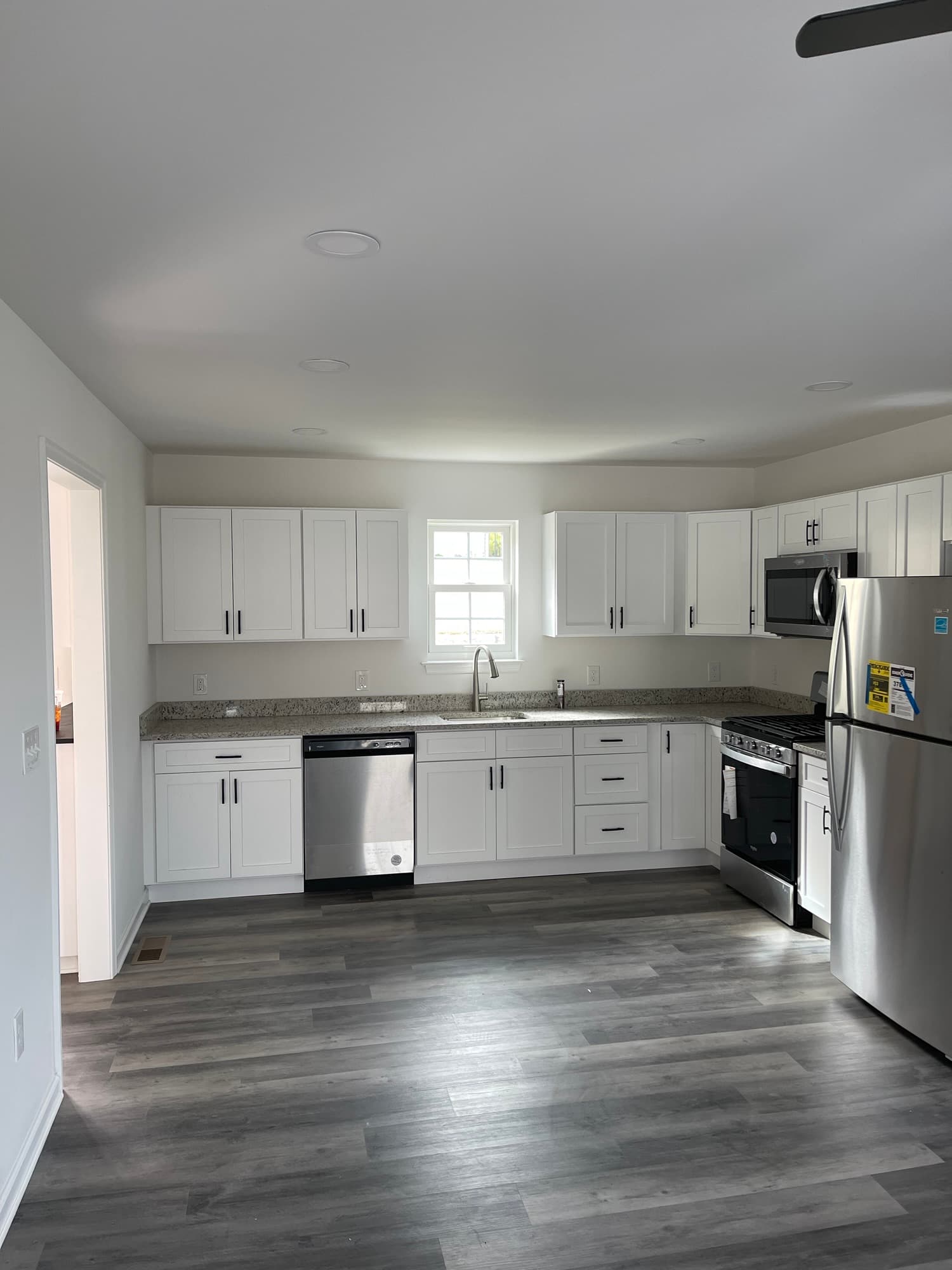 Kitchen renovation with updated cabinets and modern finishes.